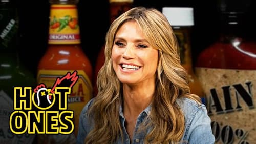 Heidi Klum Strikes a Pose While Eating Spicy Wings still