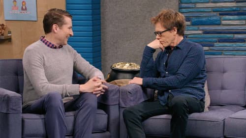 Kevin Bacon Wears a Blue Button Down Shirt and Brown Boots still